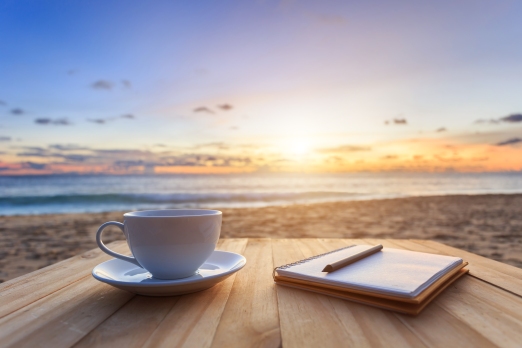 Coffee Cup On Wood Table At Sunset Or Sunrise Beach